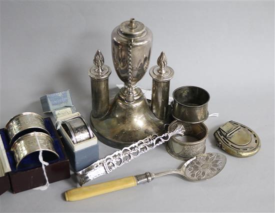 A pair of silver napkin rings, cased, sundry other silver napkin rings, plated items, including a cigar table lighter, etc.